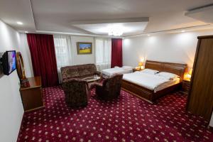 Postel nebo postele na pokoji v ubytování Gyumri Hotel + 37 fotografií