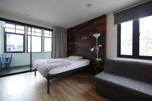 Ένα ή περισσότερα κρεβάτια σε δωμάτιο στο Lee Home Bangkok