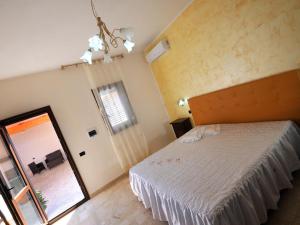 Postel nebo postele na pokoji v ubytování Il Calesse B&B