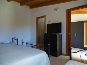Televízia a/alebo spoločenská miestnosť v ubytovaní B&B Villa Matari