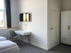 Postel nebo postele na pokoji v ubytování Best Boarding House