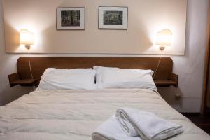 Letto o letti in una camera di Hotel Hermitage