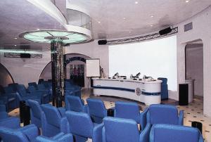 a large room with blue chairs and a tub at Residence i Morelli in Pietra Ligure +54 photos
