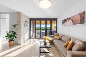 a living room with a couch and a table at GRAND CENTRAL apartment with 3 bedrooms in Porec! in Poreč