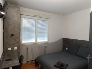 Postel nebo postele na pokoji v ubytování LE NEW FLORIMONT