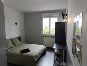 Postel nebo postele na pokoji v ubytování LE NEW FLORIMONT