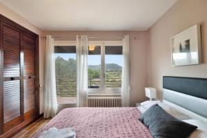 Ένα ή περισσότερα κρεβάτια σε δωμάτιο στο Cal Miró Nou +27 φωτογραφίες