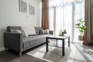 a living room with a couch and a table at Modern Stay with Wi-Fi - Tilburg in Tilburg