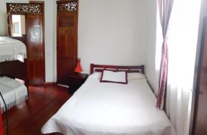 Voodi või voodid majutusasutuse Hotel Alcayata Colonial toas