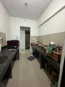 a kitchen with a long counter in a room at Apartment in Antarli in Mangrul