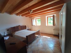 Posteľ alebo postele v izbe v ubytovaní Agriturismo Corte Maccini
