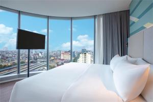 Tru by Hilton Hanoi Station客房内的一张或多张床位