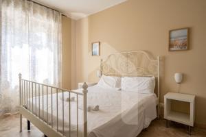 Letto o letti in una camera di Homiday - Via Michetti
