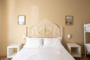 Letto o letti in una camera di Homiday - Via Michetti