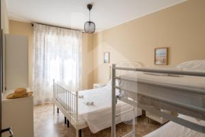 Letto o letti in una camera di Homiday - Via Michetti