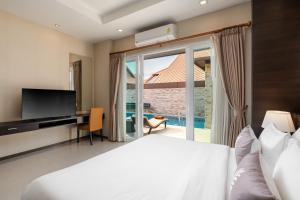 Postel nebo postele na pokoji v ubytování Luxury Pool villa C16 / 4BR 8-10 Persons + 37 fotografií
