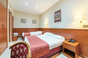 Postel nebo postele na pokoji v ubytování Hotel Riviera Fiumicino