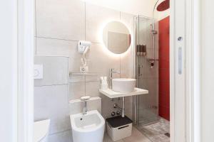 a bathroom with a sink and a toilet and a shower at Tra Lago Maggiore e lago d'Orta Appartamento FUOCO in Colazza +41 photos