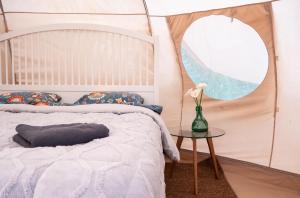 Postel nebo postele na pokoji v ubytování Glamping in Tuscany