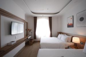Postel nebo postele na pokoji v ubytování Nature Hotel
