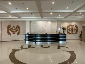 a lobby with a reception desk and a clock on the wall at Ani Resort in Artavaz +137 photos