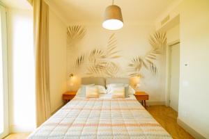 Postel nebo postele na pokoji v ubytování CASA del LAURO SUITE