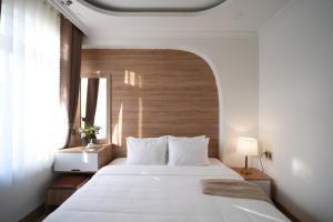Postel nebo postele na pokoji v ubytování Nature Hotel