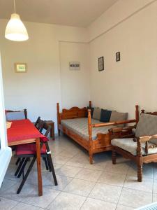 a living room with a couch and a table at Relax and enjoy in Raches