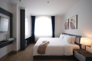 Postel nebo postele na pokoji v ubytování Nature Hotel