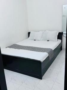 Postel nebo postele na pokoji v ubytování Hotel Ebraj Sylhet