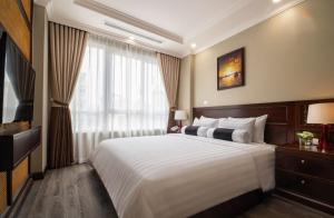 Voodi või voodid majutusasutuse Lotusama Central Hanoi Hotel toas