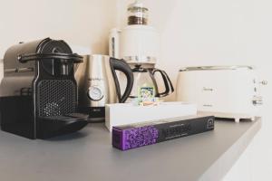 a kitchen counter with a blender and a box on it at Tra Lago Maggiore e lago d'Orta Appartamento TERRA in Colazza