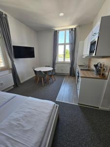TV a/nebo společenská místnost v ubytování Best Boarding House