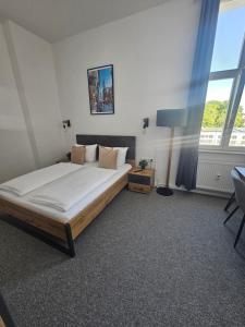 Postel nebo postele na pokoji v ubytování Best Boarding House