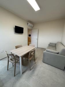 TV a/nebo společenská místnost v ubytování Appartamento Scilla centro