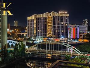 a view of a city skyline at night at South China Sea Place by Kinabina Homestay in Kota Kinabalu