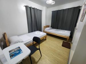 Postel nebo postele na pokoji v ubytování Jam Residences + 19 fotografií