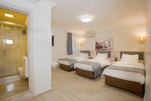Postel nebo postele na pokoji v ubytování Sim Hotel Istanbul Old City