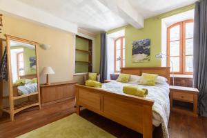 En eller flere senge i et værelse på La Petite Maison des Montagnes