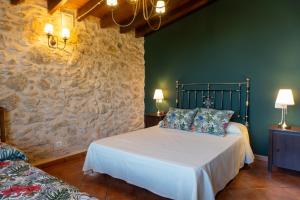 Postel nebo postele na pokoji v ubytování Apartamentos rurales La Alquería del Pilar + 37 fotografií