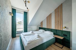 Posteľ alebo postele v izbe v ubytovaní Apartamenty Sun & Snow Angielska Grobla
