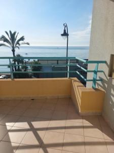 a balcony with a view of the ocean at Atelier Sonia in Roquebrune-Cap-Martin