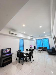 a living room with a table and chairs at reSTARY K-PLAY Themed Staycation in Kota Kinabalu