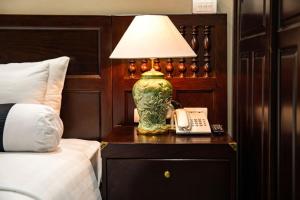 Voodi või voodid majutusasutuse Lotusama Central Hanoi Hotel toas