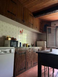 a kitchen with wooden cabinets and a counter top at Belle chambre en bois chez Antoine in Montpellier +17 photos