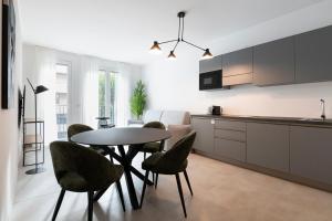 a kitchen and dining room with a table and chairs at RELSTAY - De Angeli in Milan +93 photos