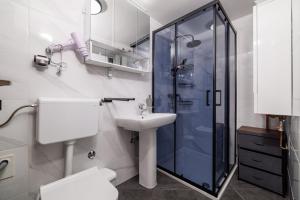 a bathroom with a shower and a sink at Bobbys Home in Selce +42 photos