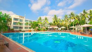 a large swimming pool in front of a hotel at Lancaster Accra in Accra