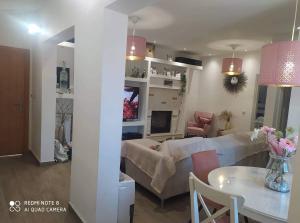 a living room with a couch and a table at Luxury mini villas AA in Kríni +67 photos