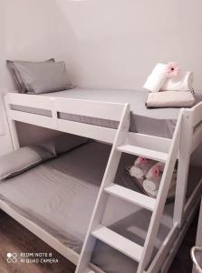 a white bunk bed in a room at Luxury mini villas AA in Kríni